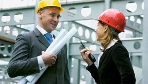 Young woman and construction Manager on a construction site.